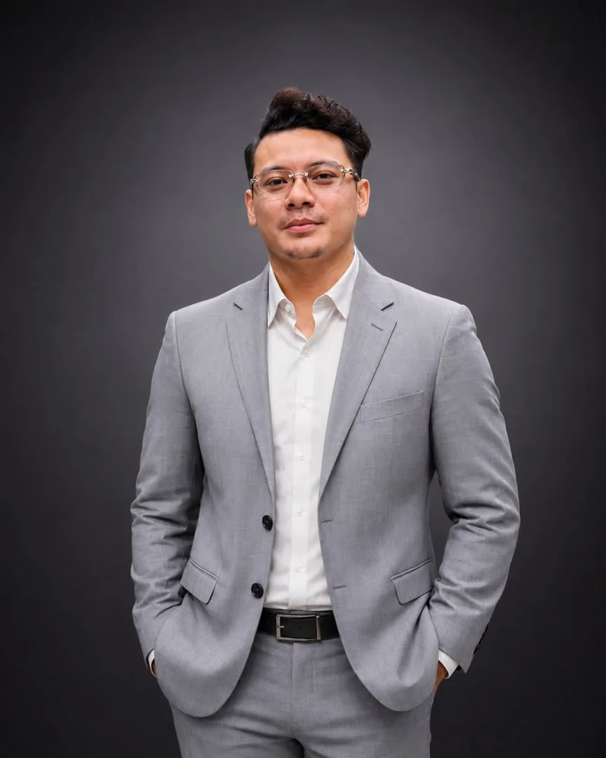 Nique in a grey suit