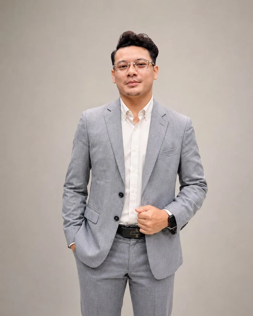 Nique in a grey suit